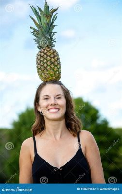 person who does yoga, and the art of balancing a pineapple on their head